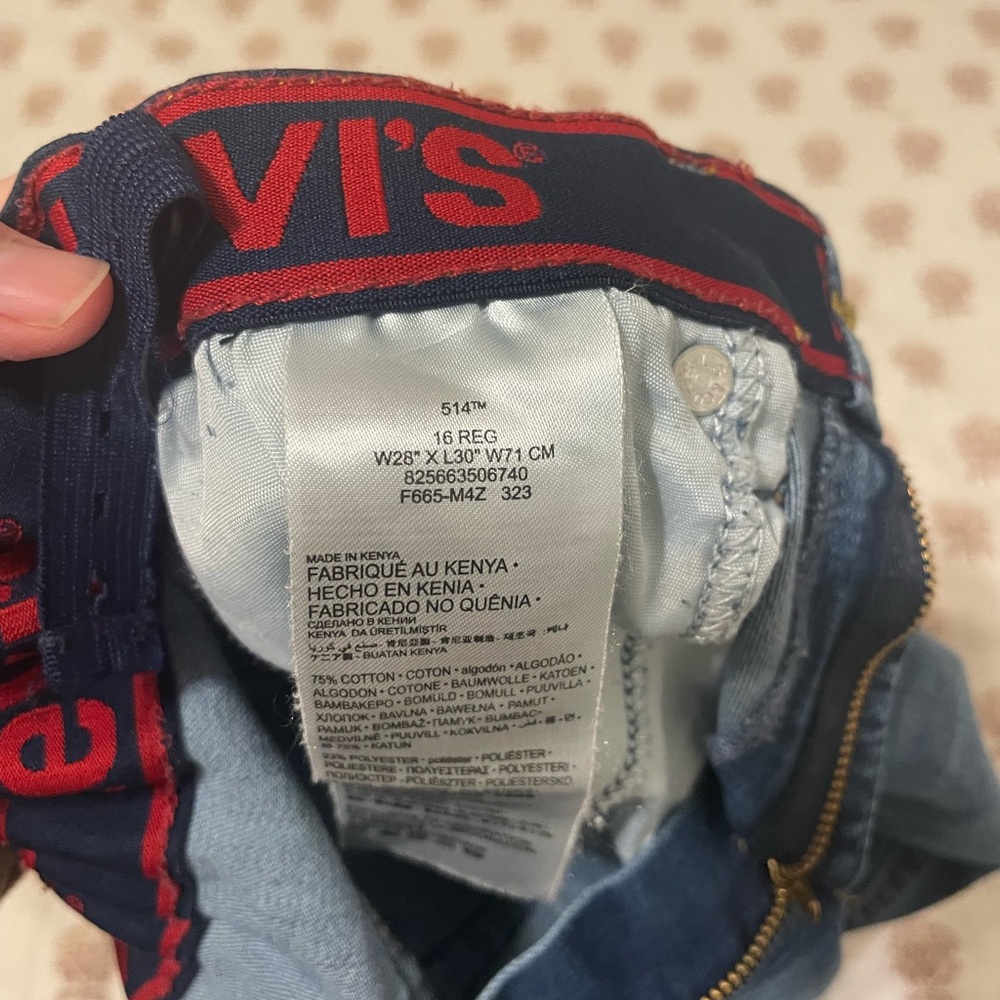Levi’s straight jeans. Not quite wide leg. Has adjustable elastic waist.
